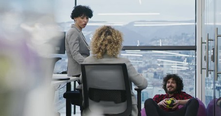 Portrait of successful business couple software developers at busy startup of