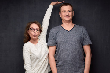 shot of funny short woman and tall man