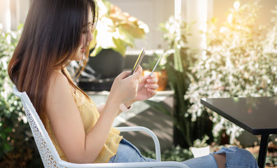 Wall Mural - Young asian woman using credit card to payment and shopping online with smartphone