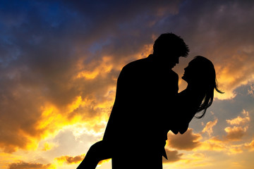 Poster - loving couple at sunset