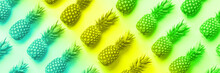 Fresh Pineapples On Vibrant Rainbow Gradient Background. Top View. Pop Art Design, Creative Concept. Copy Space. Neon Pineapple Pattern For Minimal Style.