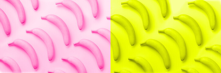 Wall Mural - chaotic colorful fruit pattern. bananas over neon pink and yellow color background. banner. top view