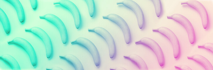 Wall Mural - geometric colorful fruit pattern. bananas over rainbow gradient background. banner. top view. pop ar