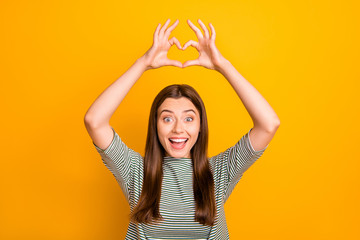 Poster - Photo of attractive wonderful woman gifting her love to you free of charge while isolated with yellow background