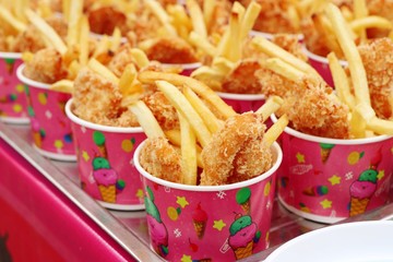 Canvas Print - French fries and fried chicken at market