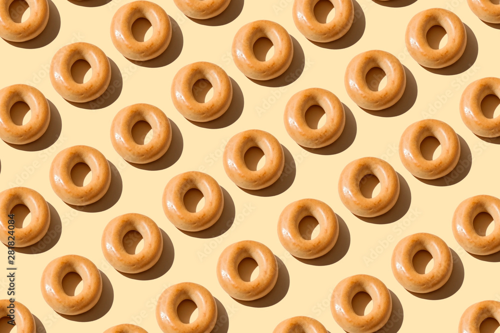 Bagels pattern on a peach color background. Bakery product template ...