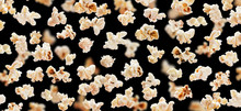 Flying Popcorn Isolated On Black Background