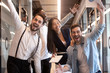 Excited funny multiethnic business team stand in office, portrait