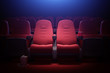 Interior of empty movie theater with red seats