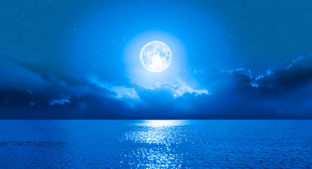 Wall Mural - Moon over the sea with lot of stars and nebula at night 