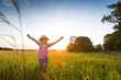 © mmphoto - Happy girl enjoying the sunset at the countryside