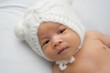 © KanyaphatStudio - Close up of Asian newborn baby on white background