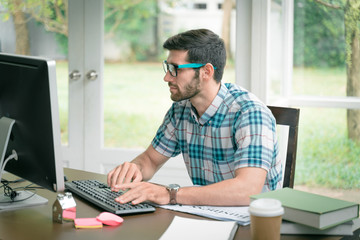 success concept. Young modern businessman relaxing with computer while sitting in the office. The successful business analysis, creative design to analyze the management of the investment.