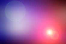 Abstract Blurred Background And Light Flash Of Light. Purple, Pink And Orange Spot.
