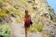 © zigres - Young hiker woman back view walking on mountain path