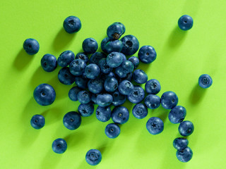 Wall Mural - blueberry berry on a green background. summer and vitamins