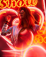 Sexy Young Beauty Woman Posing Over Night City Dramatic Red And Yellow Neon Lights