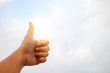 © SUPERMAO - Men's hands thumbs up. The background is the sky Have space to write messages