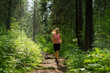 © Evgeny - young woman jogging in a mountain forest