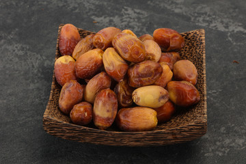 Sweet tasty dry dates in the basket