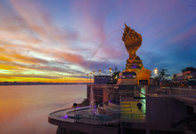 Yard Serpent Spits Water On The Mekong River In Nakhon Phanom With Sunrise.