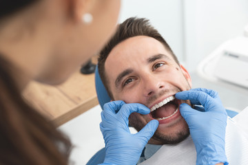 Wall Mural - Man having a visit at the dentist's