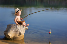 Little Boy Fishing On The Lake
