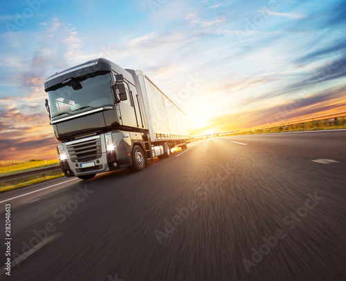 Fotomural European truck vehicle with dramatic sunset light
