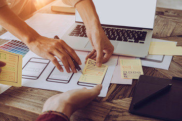 Web designer meeting  planning application for mobile phone. Design Online Technology Content, Ideas Proposal Strategy Tactics Vision Design Concept