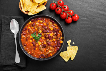 Wall Mural - Traditional mexican dish chili con carne with minced meat and red beans. 