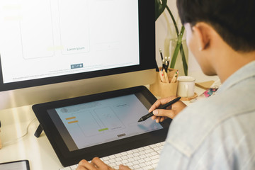 Web designer planning application for mobile phone. Design application development draft sketch drawing online Technology Content.User experience concept.