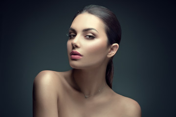 Poster - Sexy beauty brunette woman with perfect makeup. Beauty girl's face on dark background. Skincare