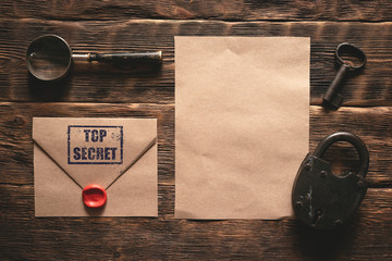Wall Mural - top secret document paper page template on a wooden table of secret service agent flat lay backgroun