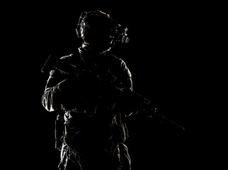 Special forces fighter in darkness studio shoot