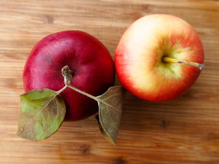 Wall Mural - Juicy ripe apple on a wooden board