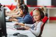 © Volha - Mixed Racial group Of Elementary School Children In Computer Class