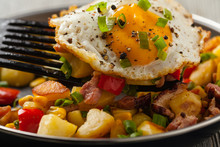Traditional American Hash With Fried Eggs. Front View.