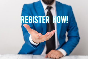 Text sign showing Register Now. Business photo text official list or record showing or things into web or forum Man holds empty paper with copy space in front of him Copy Space