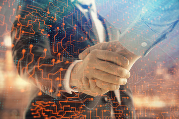 Double exposure of abstract technology drawing on cityscape background with two businessmen handshake. Concept of tech role in business