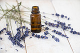 Fototapeta  - Essential lavender oil and dry lavender flowers