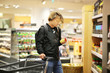 © lado2016 - Young man shopping in supermarket, reading product information