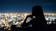 © jaboo_foto - silhouette Woman portrait  in city night light bokeh background , Chiang mai ,Thailand