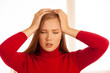 © Samo Trebizan - Young blonde woman having serious migrene suffering from horrible head ache feeling horrible pain.