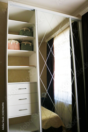 White Wardrobe With Mirror Build In The Wall Room With The
