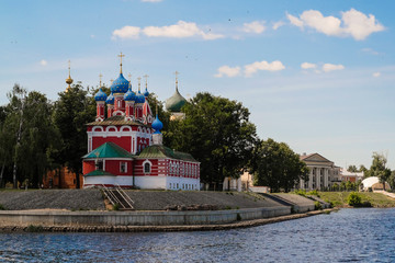 Wall Mural - Uglich, Russia - June, 17, 2019: embankment of Volga river in Uglich, Russia with a view to .Dmitry's Church on the Blood