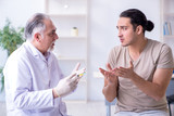 Fototapeta  - Male patient visitng doctor for shot inoculation