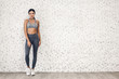 © Art_Photo - Sport woman in sportswear relax stand after workout against copy space for adding text with white wall background.Diet concept.Fitness and healthy lifestyle