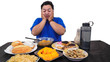 fat or overweight Asian man surprise and happy with a lot of unhealthy food on the table isolated in white