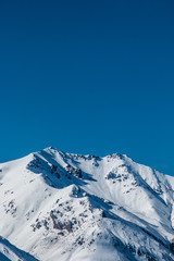 Wall Mural - mountains in winter, snow capped peaks, mountain winter landscape