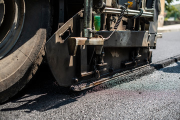 Asphalting machine on the road.